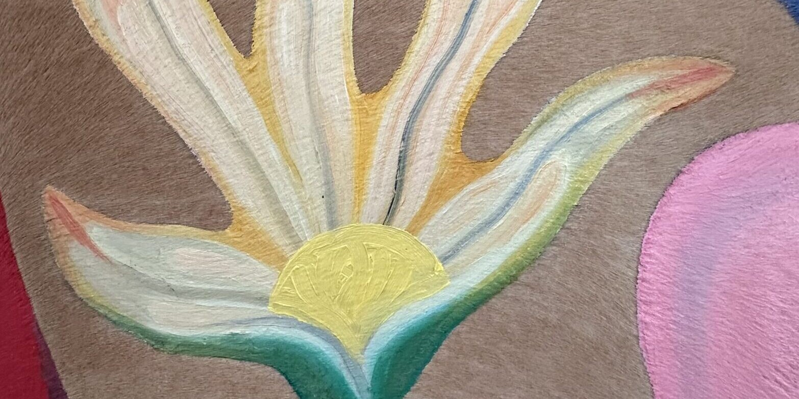 A painting of a flower on deer hide