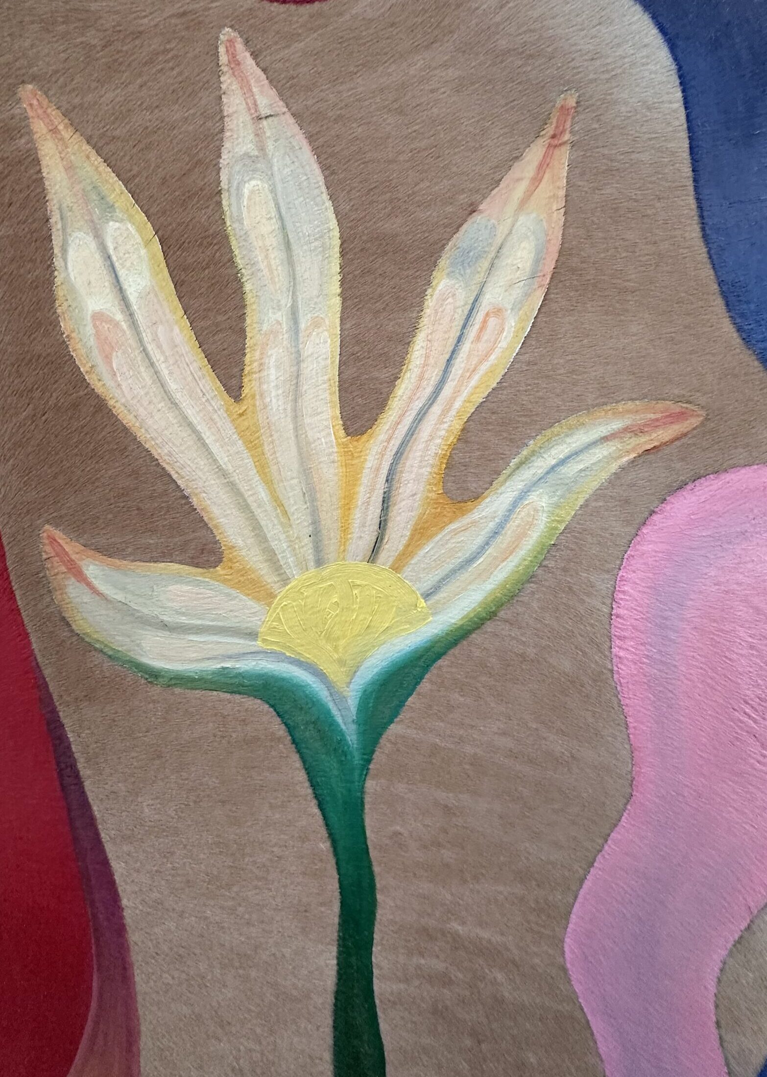 A painting of a flower on deer hide